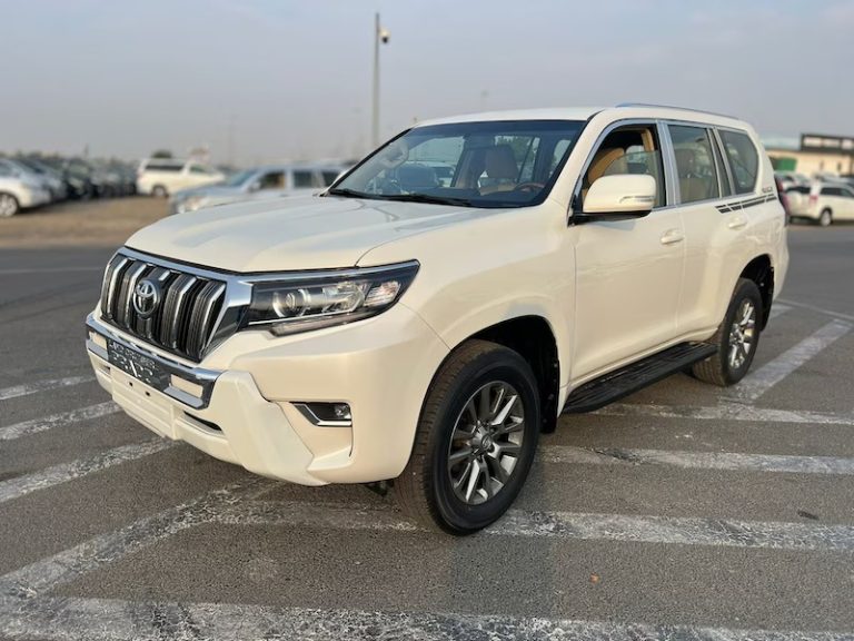 Toyota Land Cruiser Prado 4x4 parked near Akagera National Park savanna on a self-drive adventure with Kigali Car Rent