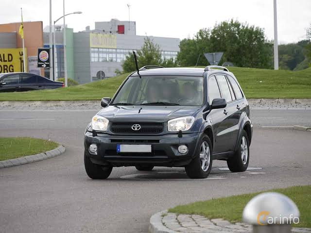 Toyota RAV4 4x4 self-drive car rental in Rwanda parked along scenic road in Musanze