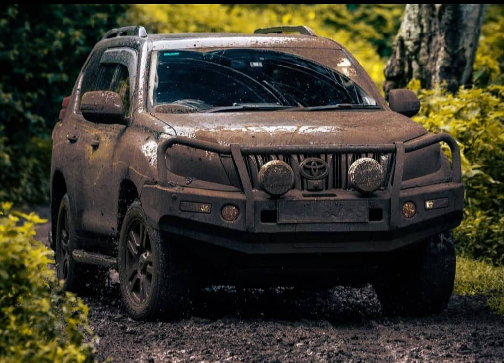 Self-drive Rwanda Uganda safari with a 4x4 rental vehicle on a scenic East African road
